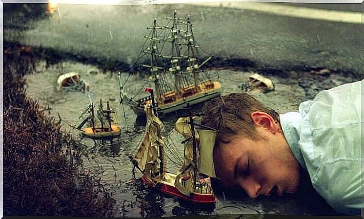 man connected to dreams while sleeping on a puddle