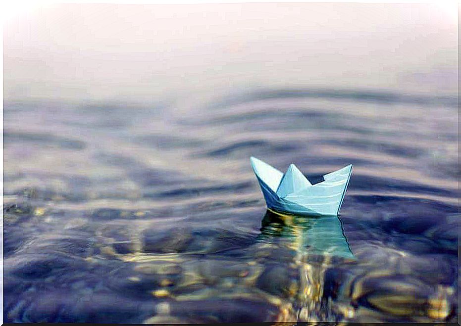 Paper boat in the water