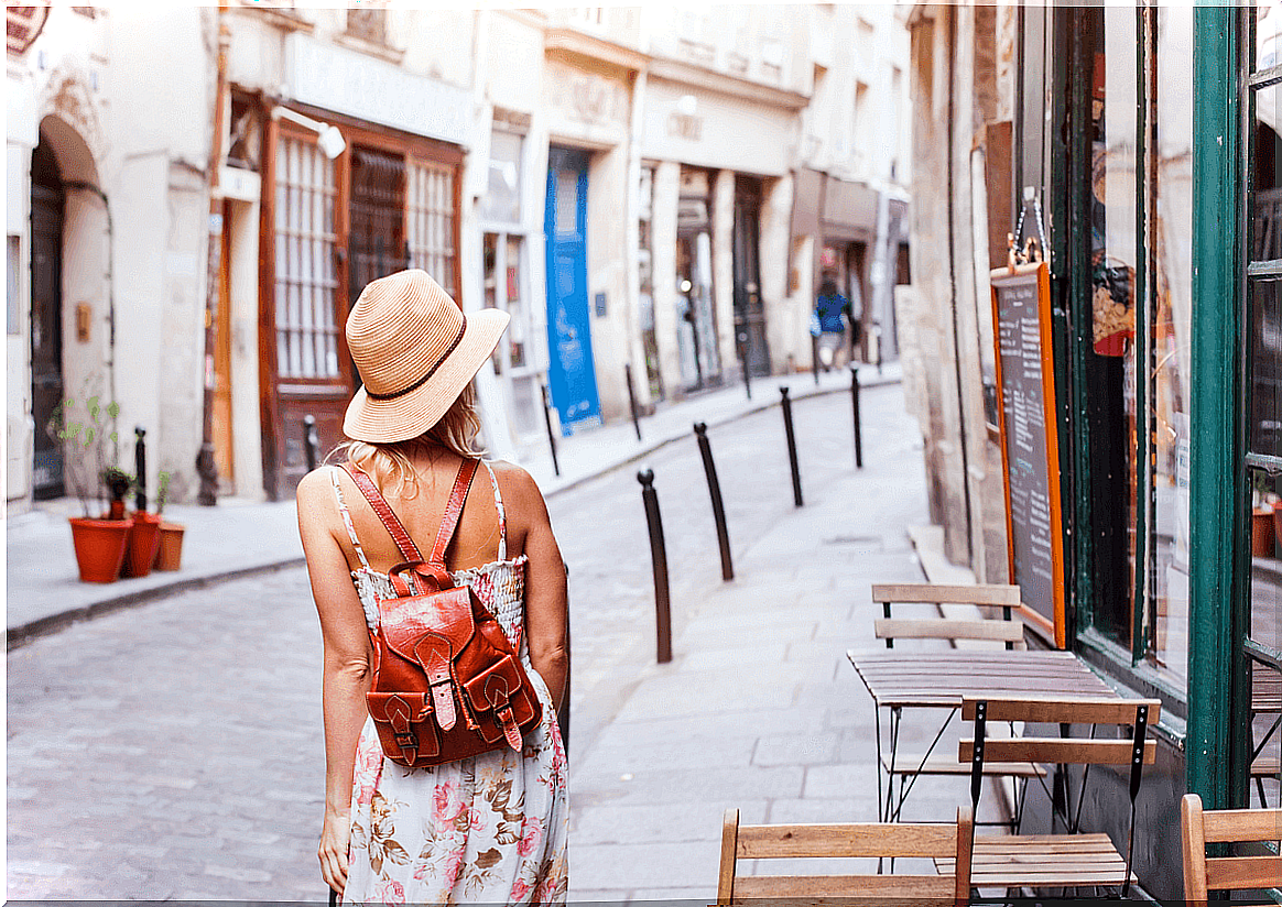 Woman walking through a city