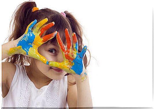 Little girl with painted hands