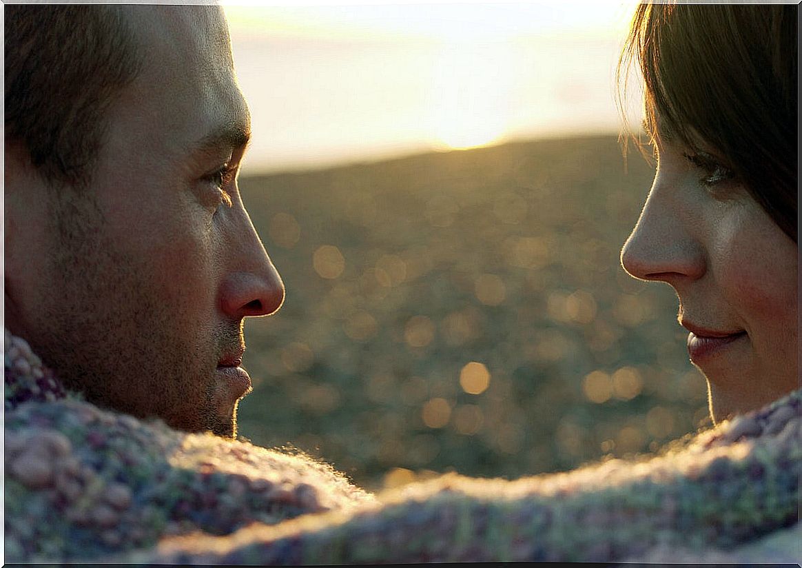 Couple looking into the distance representing how childhood traumas affect a couple's relationship