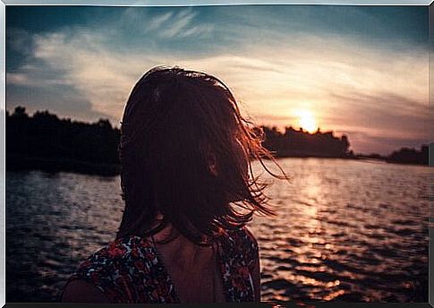 Woman looking at the sunset