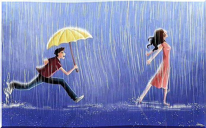 Man holding a yellow umbrella behind a woman while it rains