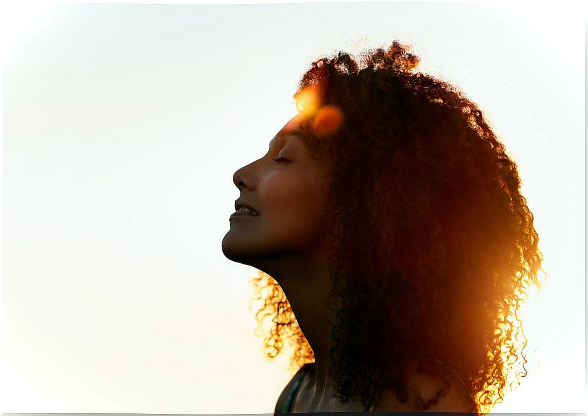 Woman with closed eyes depicting how to cope with generalized anxiety disorder