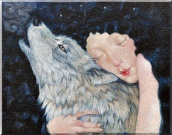 Woman hugging a wolf with sadness