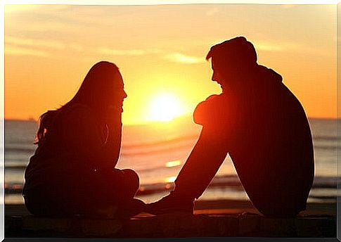 Friends talking at sunset