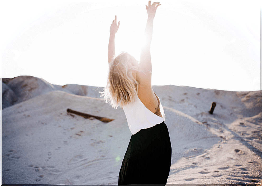 Woman raising hands thinking about her personality