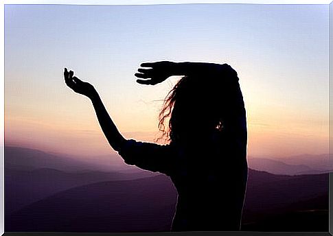 Woman dancing at dusk