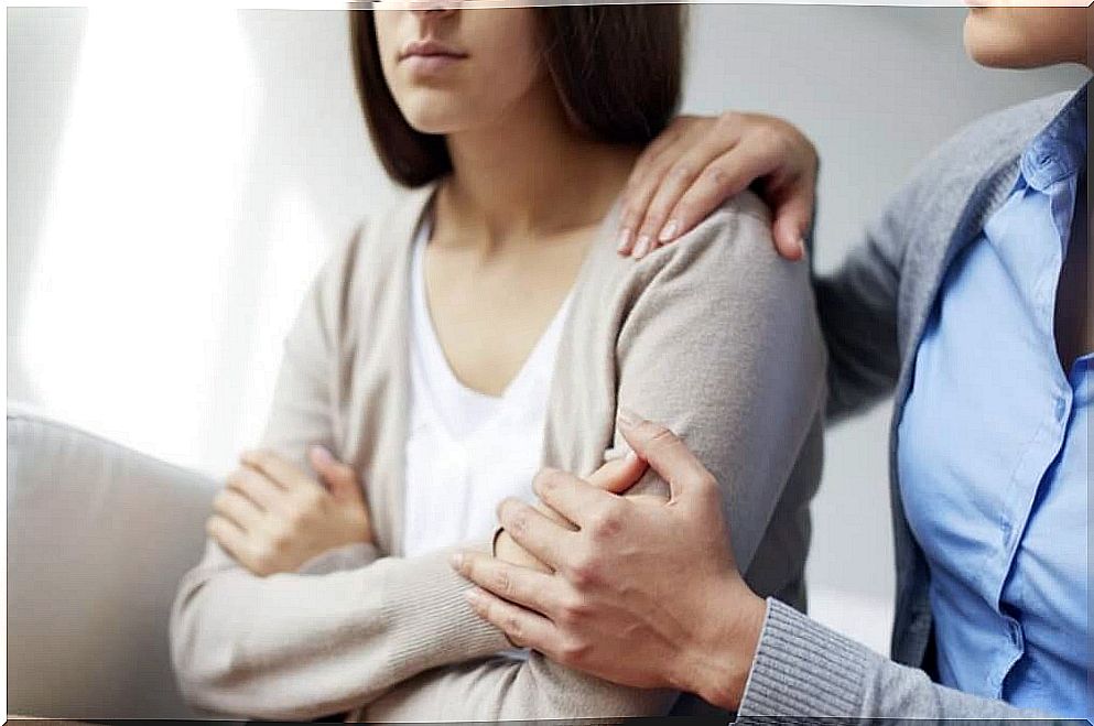 Depressed woman with a friend