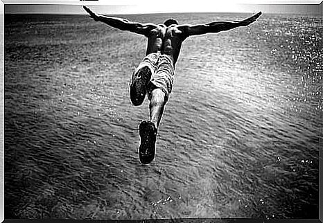 Man jumping into the sea