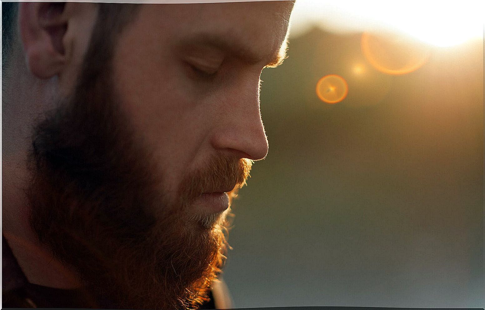 Man reflecting with eyes closed