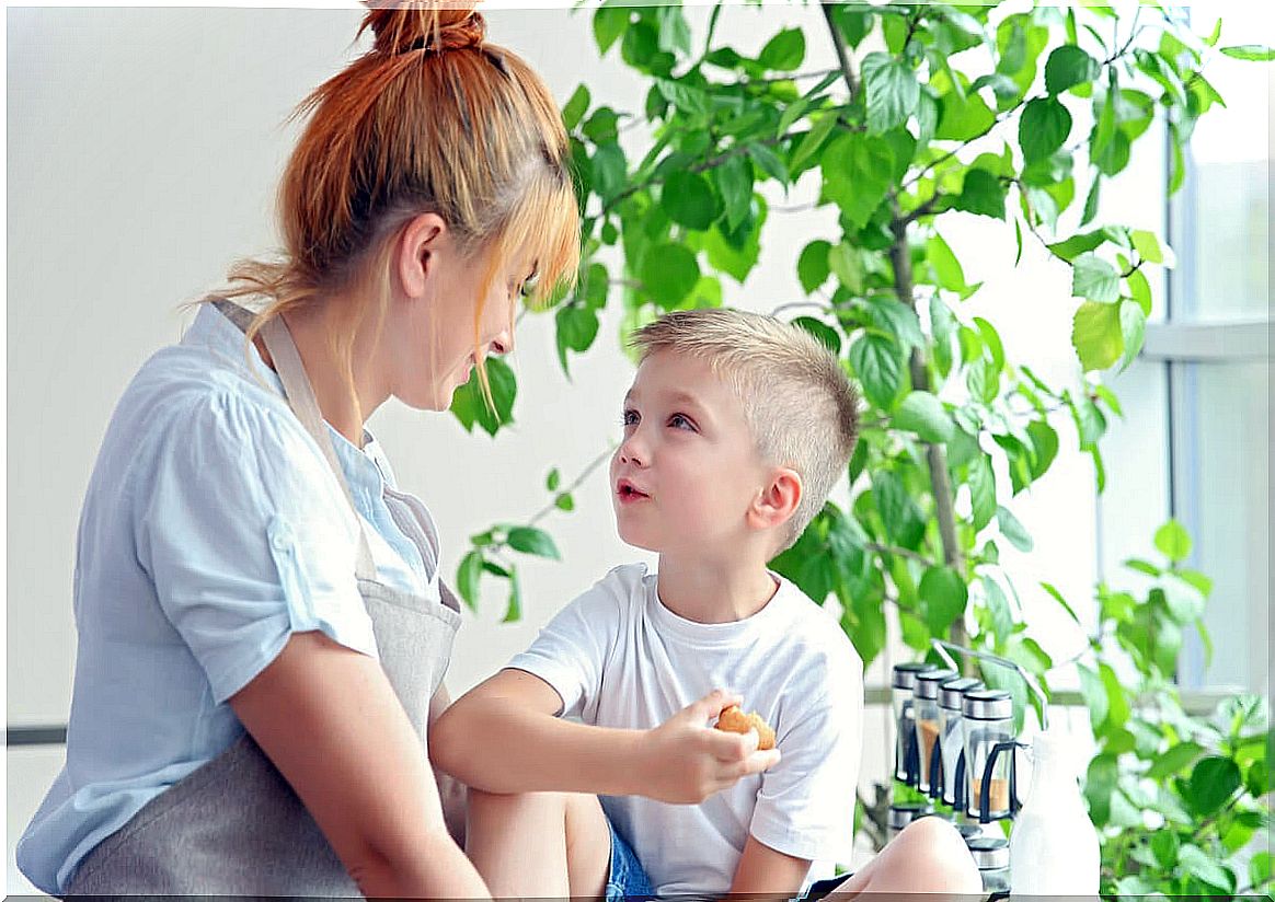 Mother talking to her son with an empathetic attitude