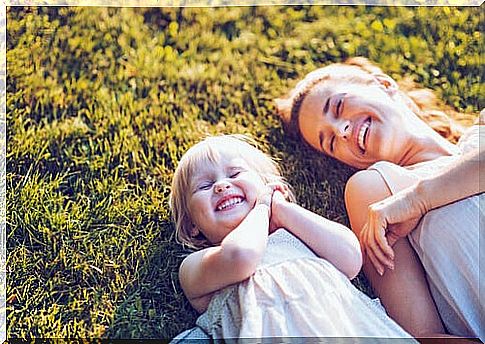 Mother and daughter smiling