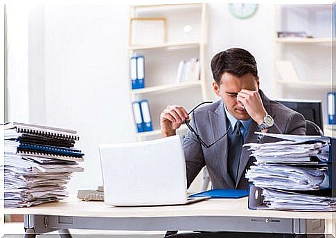 Stressed man symbolizing when work life is not compatible with health